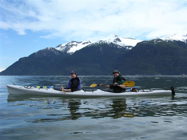 Guests paddle stable tandem sea kayaks 